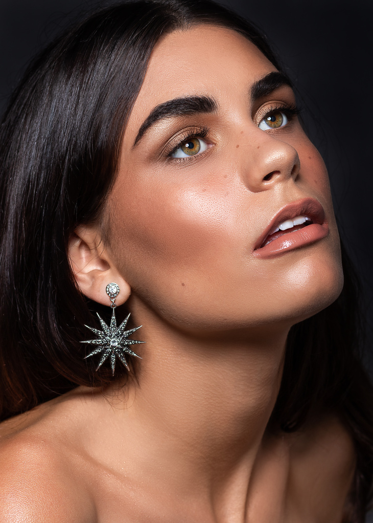 Brunette Model Wearing Dangle Earrings 